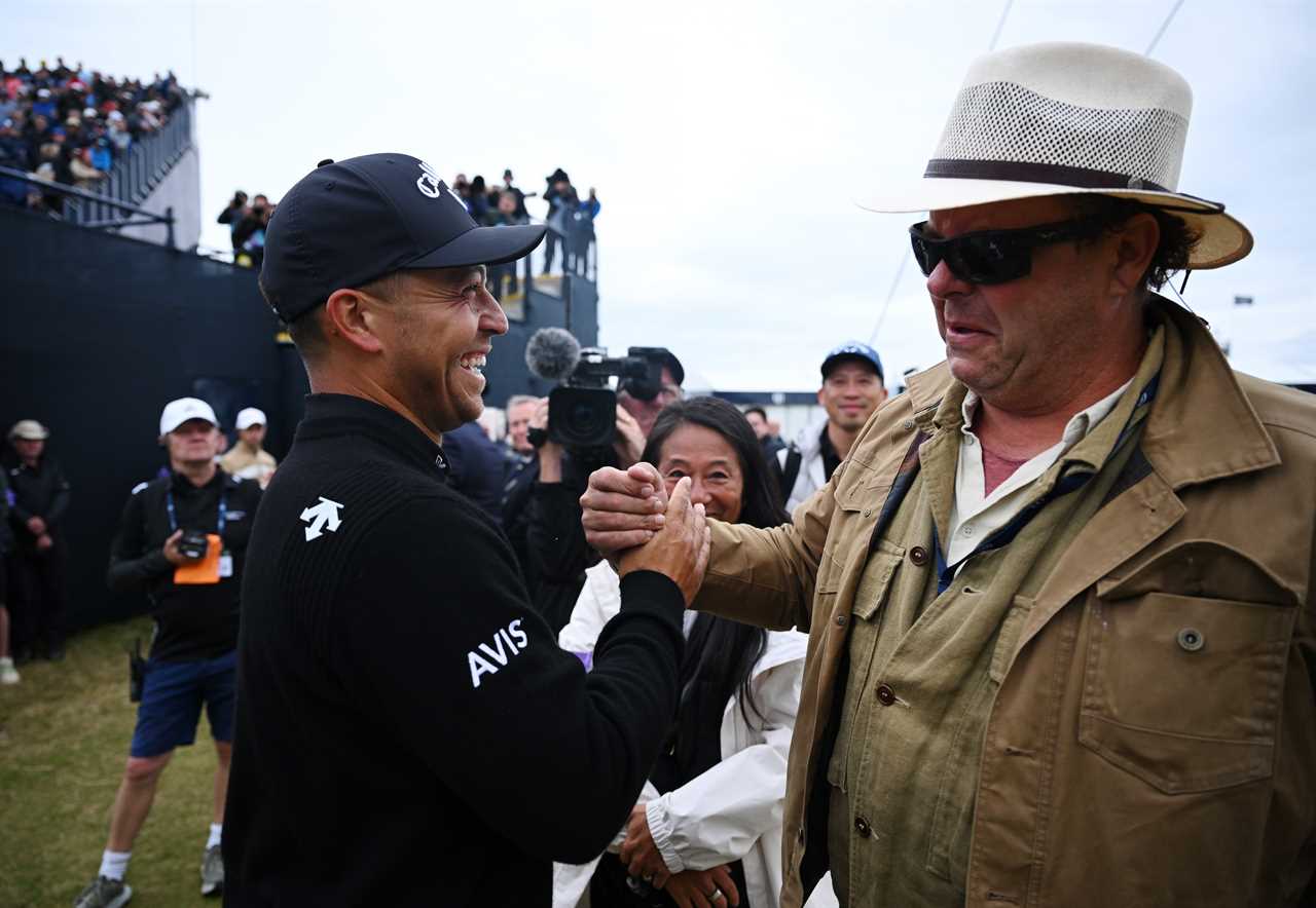 Xander Schauffele congratulated by his father.