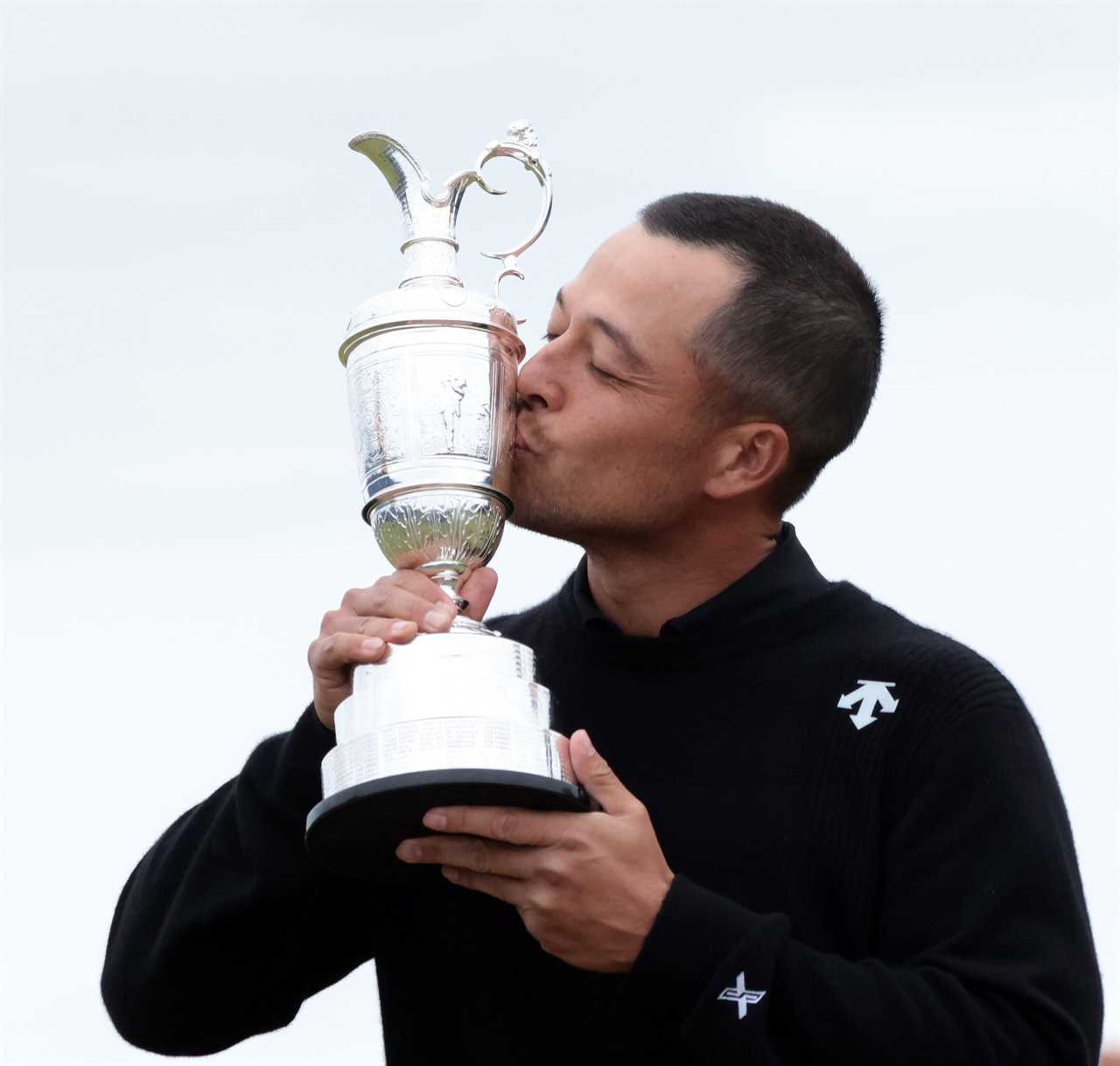 Xander Schauffele kissing the Claret Jug after winning the Open Championship.