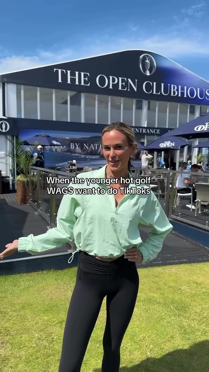 Woman in mint green top and black leggings outside The Open Clubhouse.
