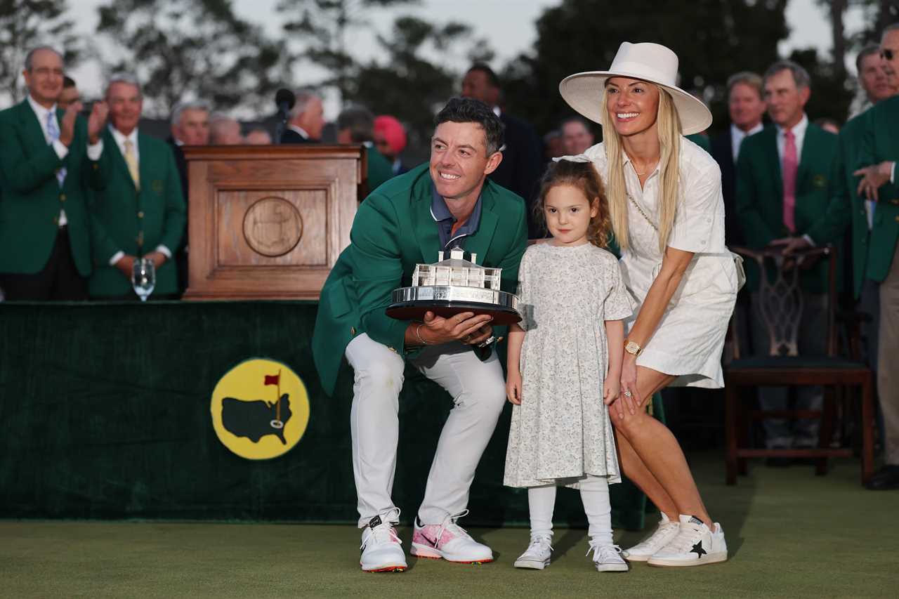 Rory McIlroy with his family and the Masters trophy.