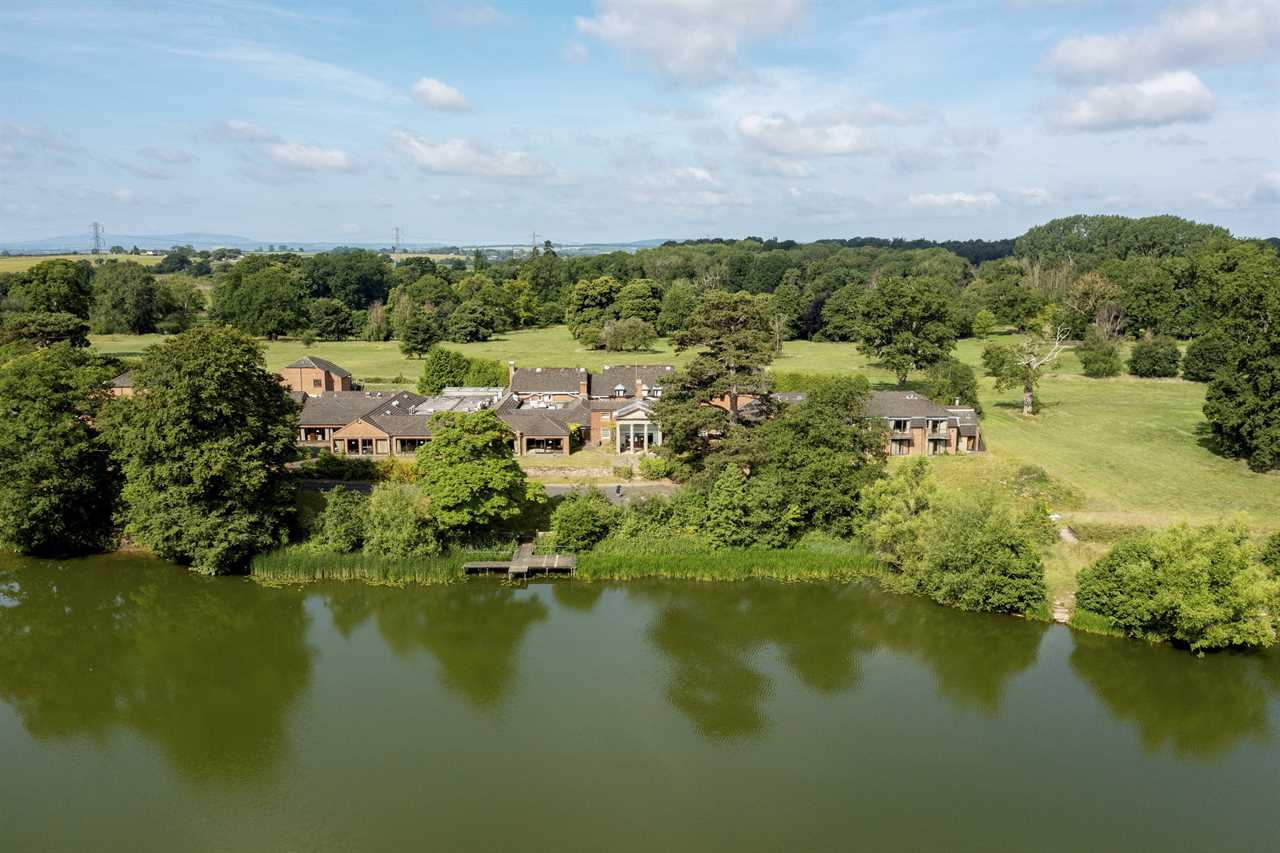 Aerial view of Patshull Park Hotel Golf and Country Club, situated on a lake.