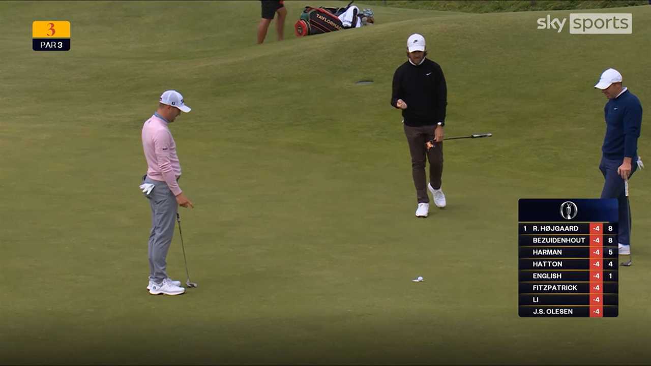 Justin Thomas putting on a golf green.