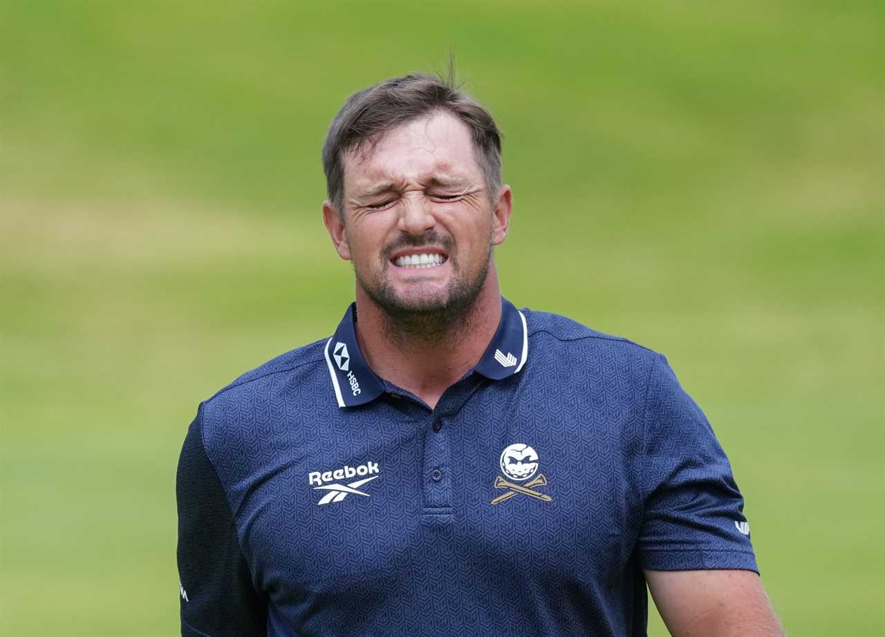 Bryson DeChambeau grimacing after missing the cut at The Open Golf.