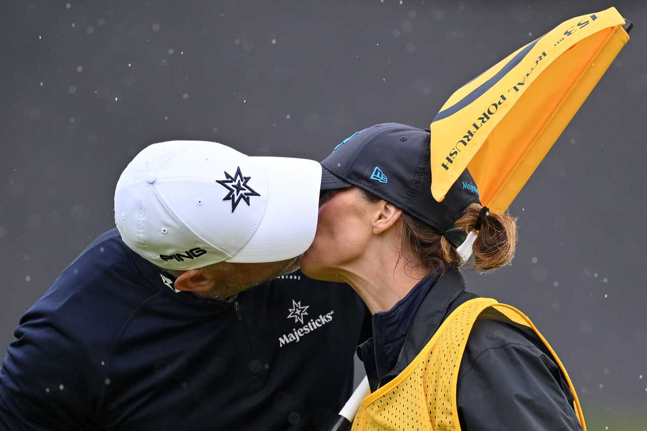 Lee Westwood kissing his wife after a golf match.