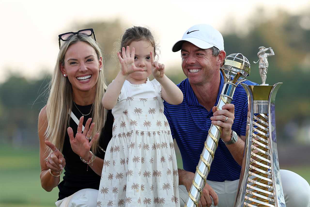 Rory McIlroy with his wife and daughter celebrating his sixth Race to Dubai title.