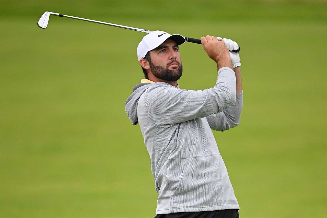 Scottie Scheffler taking a golf shot.