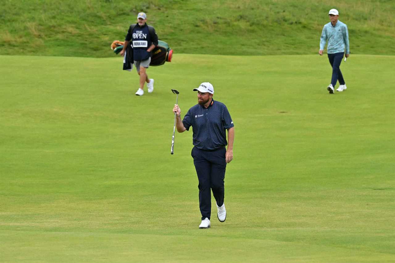 Shane Lowry walking on a golf course.