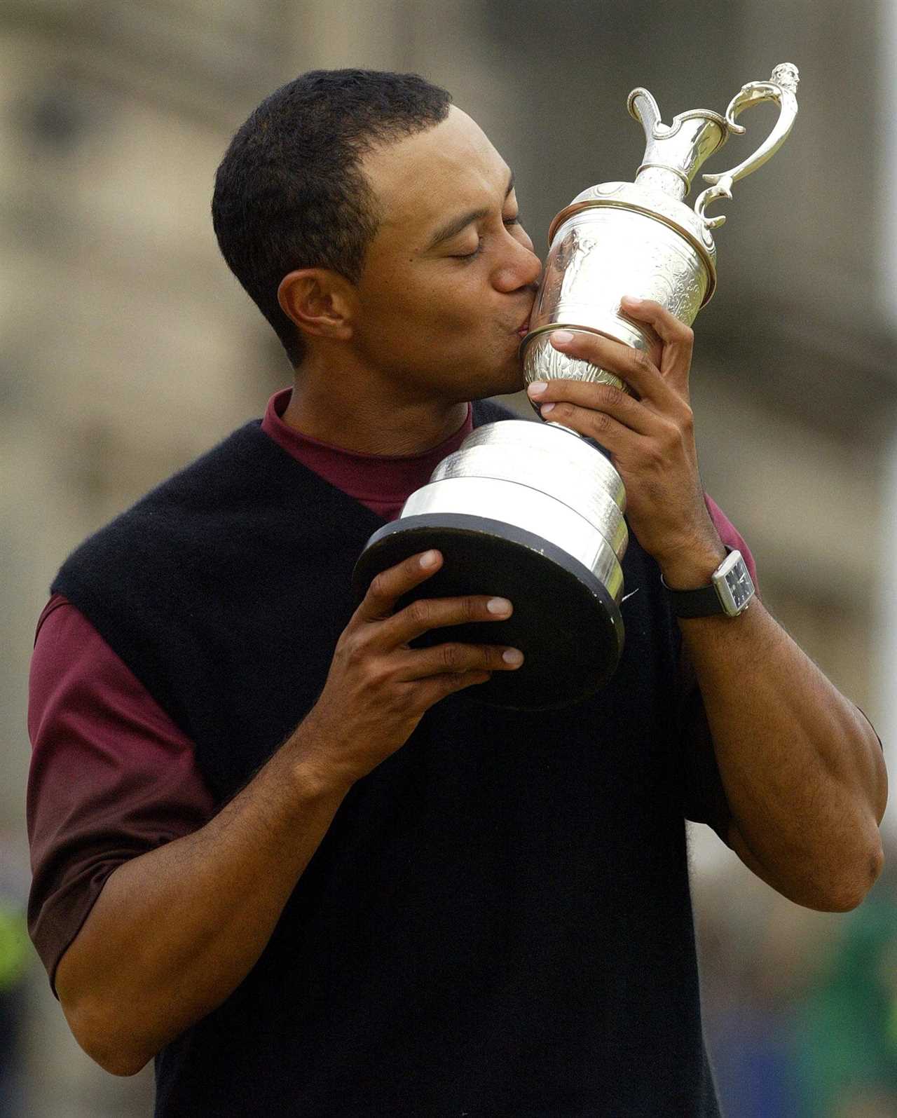 Tiger Woods kissing the Claret Jug after winning the Open Championship.