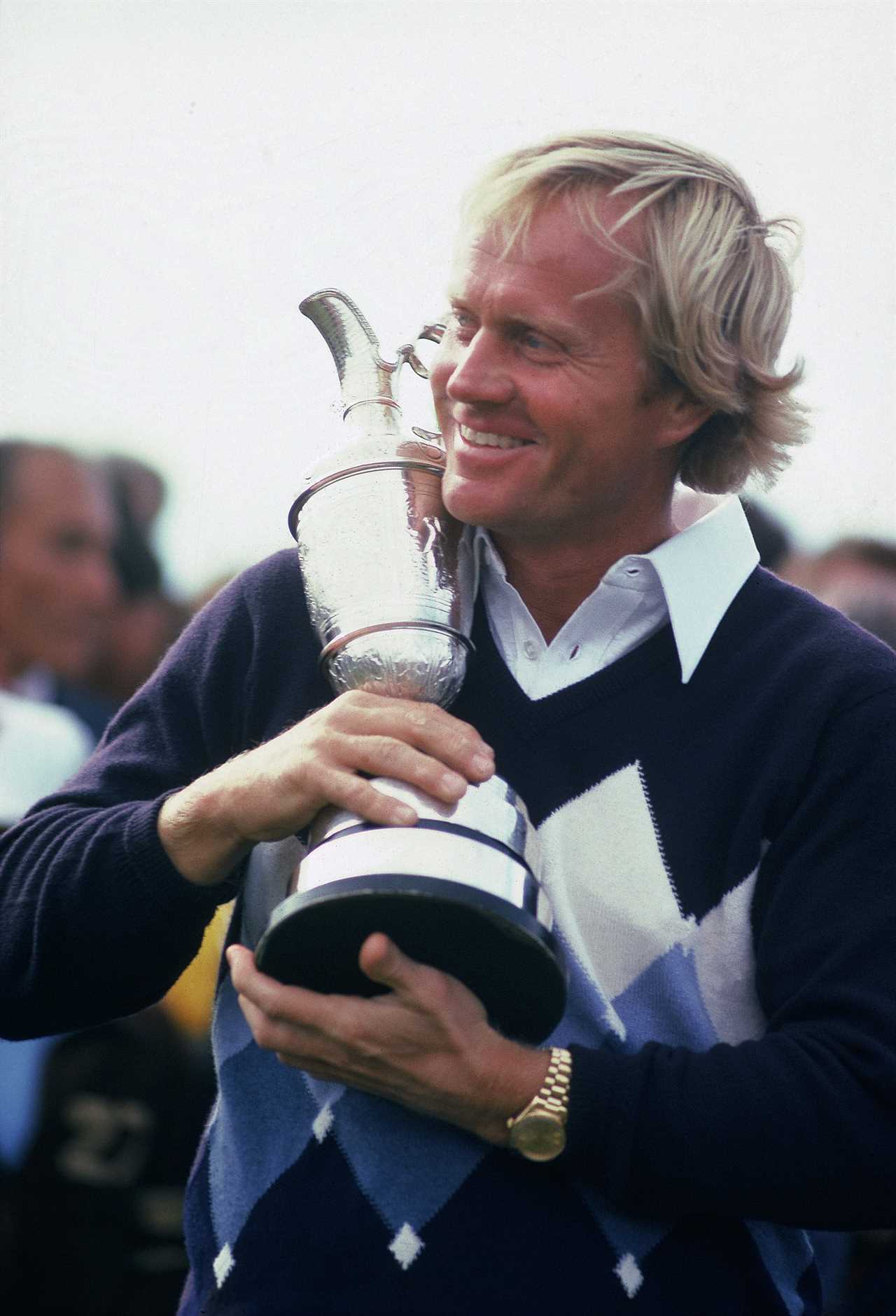 Jack Nicklaus holding a trophy after winning the British Open.