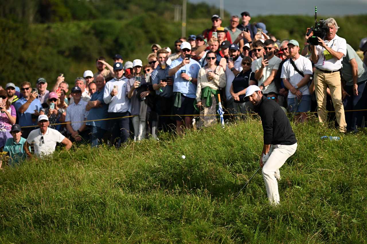 Scottie Scheffler playing a golf shot.