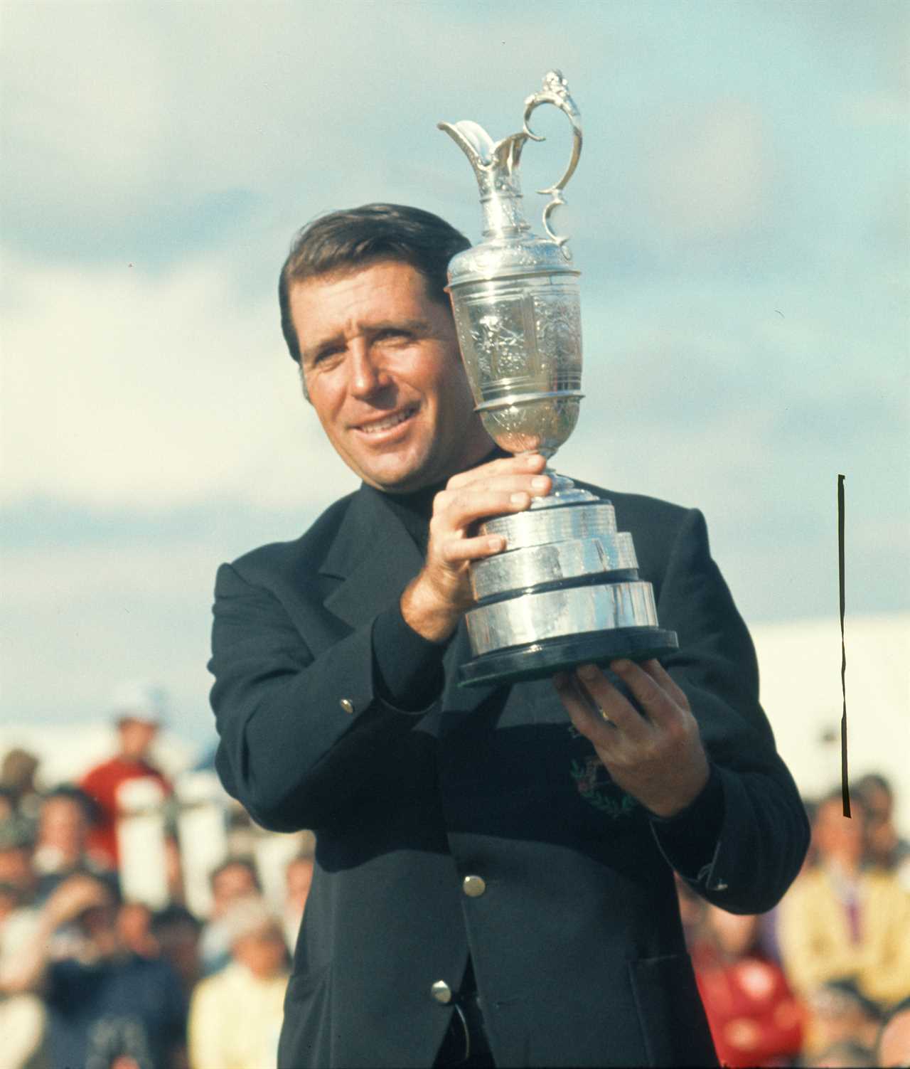 Gary Player holding the Open Championship trophy.