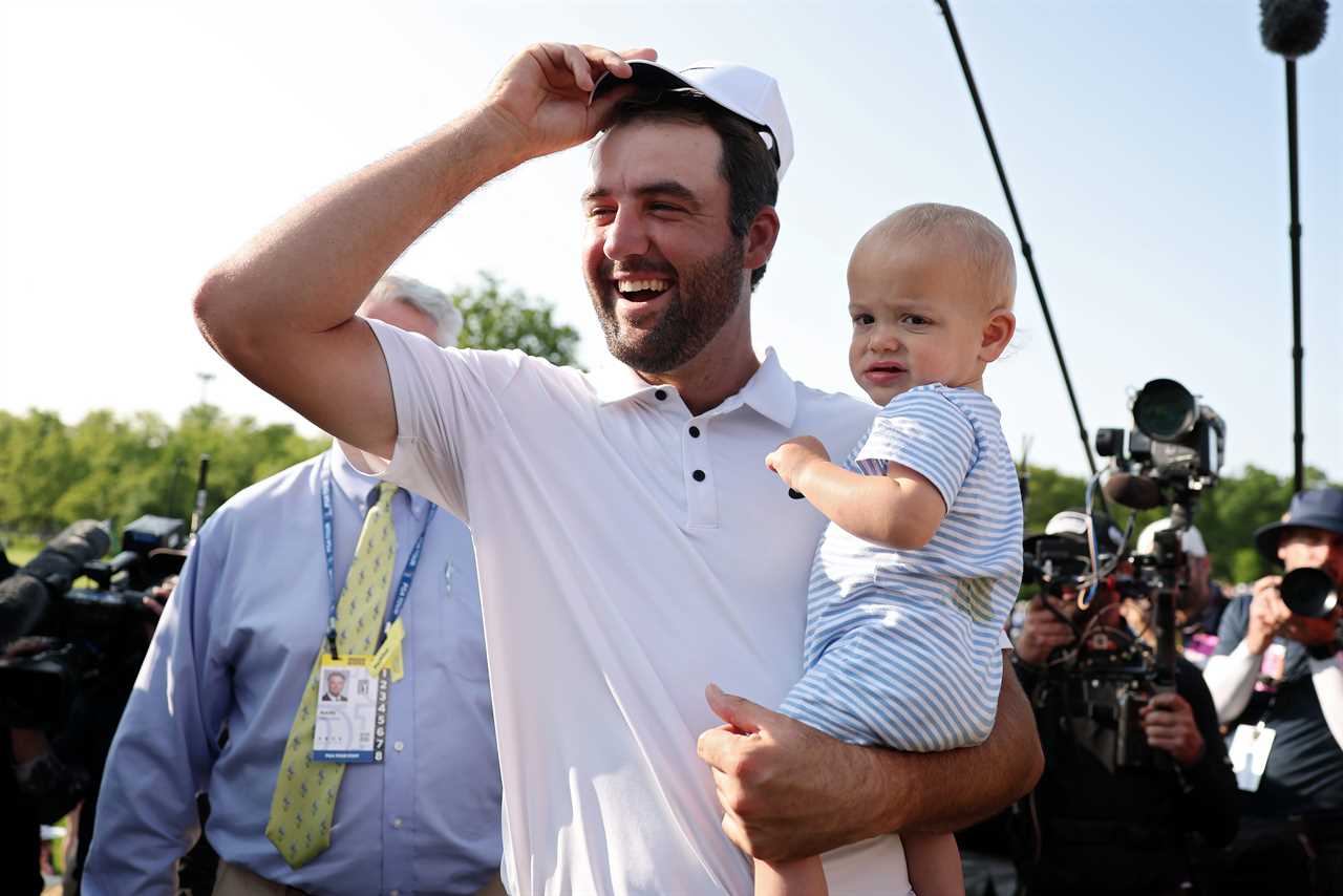 Scottie Scheffler celebrates his Memorial Tournament win with his son.