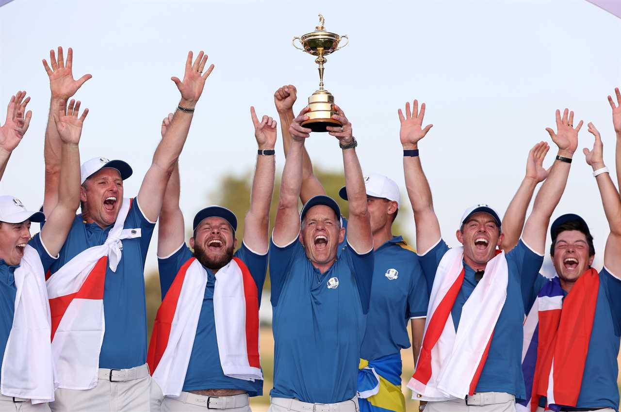 Team Europe celebrating Ryder Cup victory, lifting the trophy.