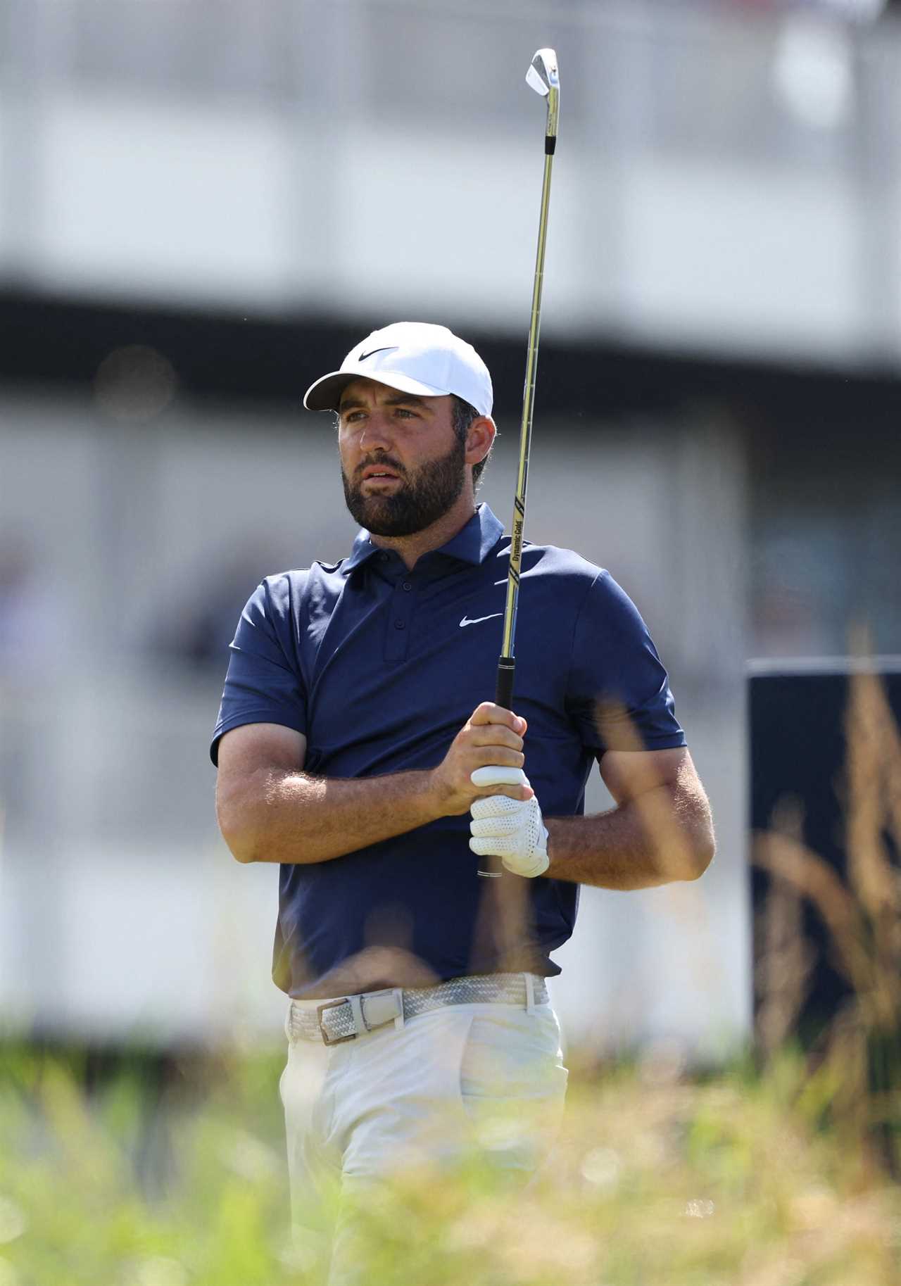 Scottie Scheffler holding a golf club.