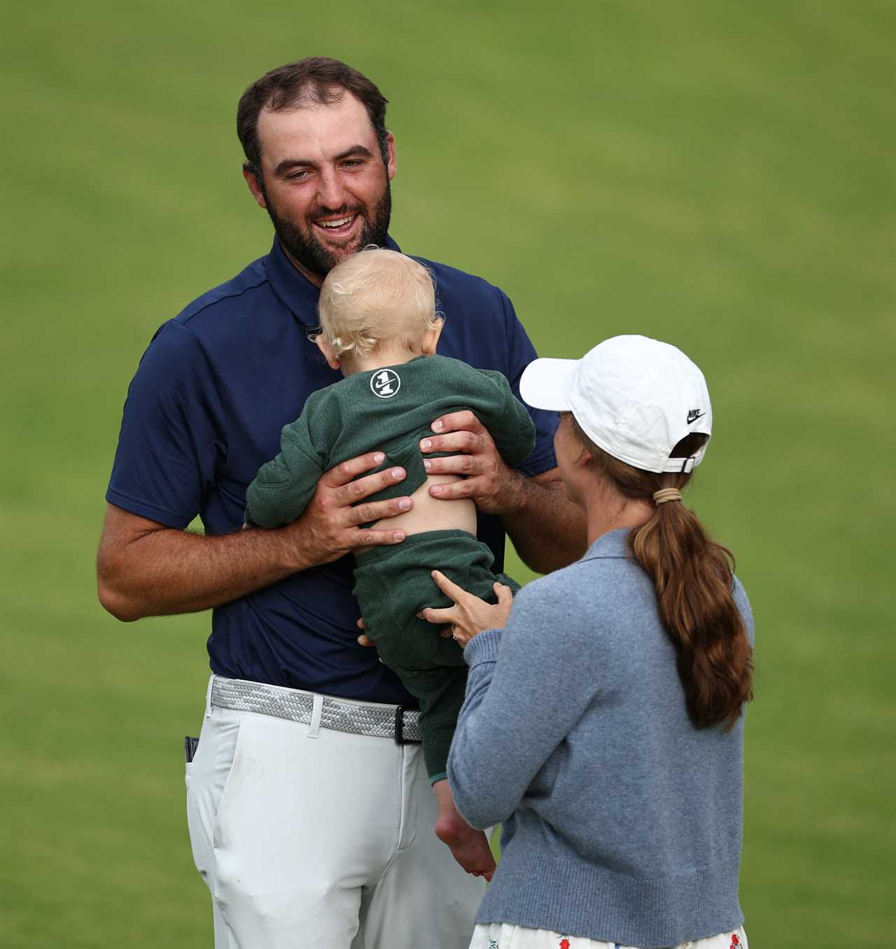 Scottie Scheffler celebrates his British Open victory with his wife and son.