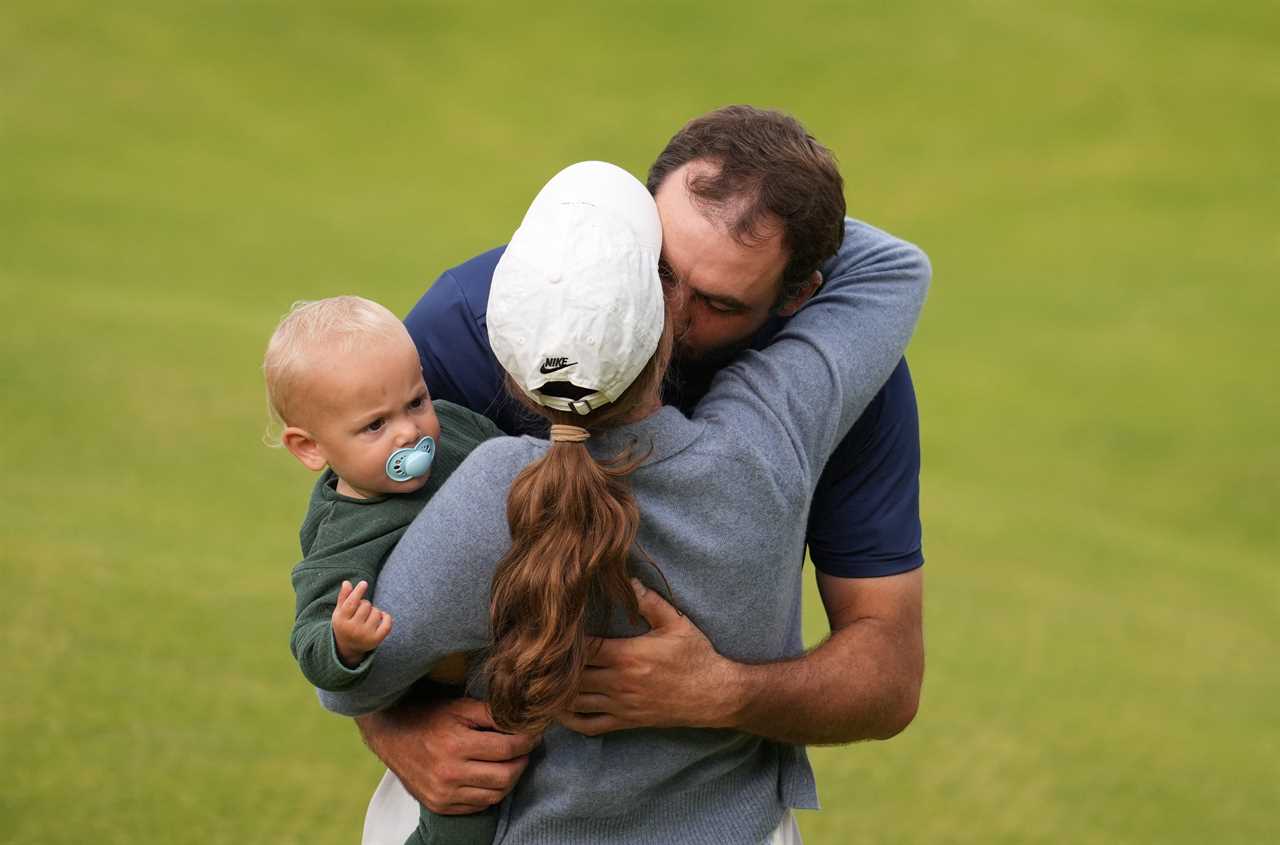 Scottie Scheffler embraces his wife and son after winning a golf tournament.