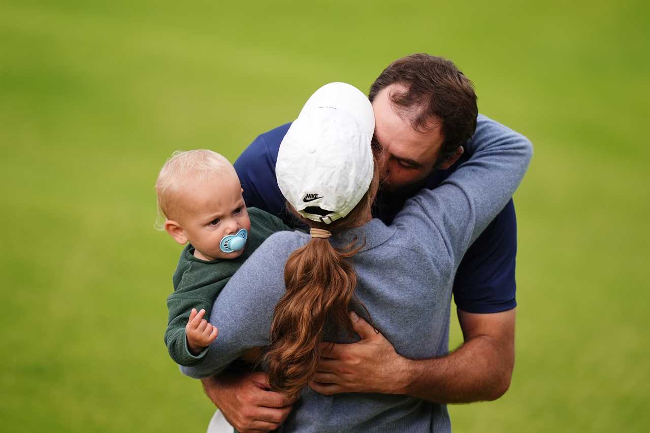 Scottie Scheffler celebrates with his wife and son after winning The Open.