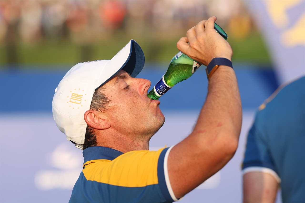 Rory McIlroy pouring sparkling wine into his mouth after winning the Ryder Cup.