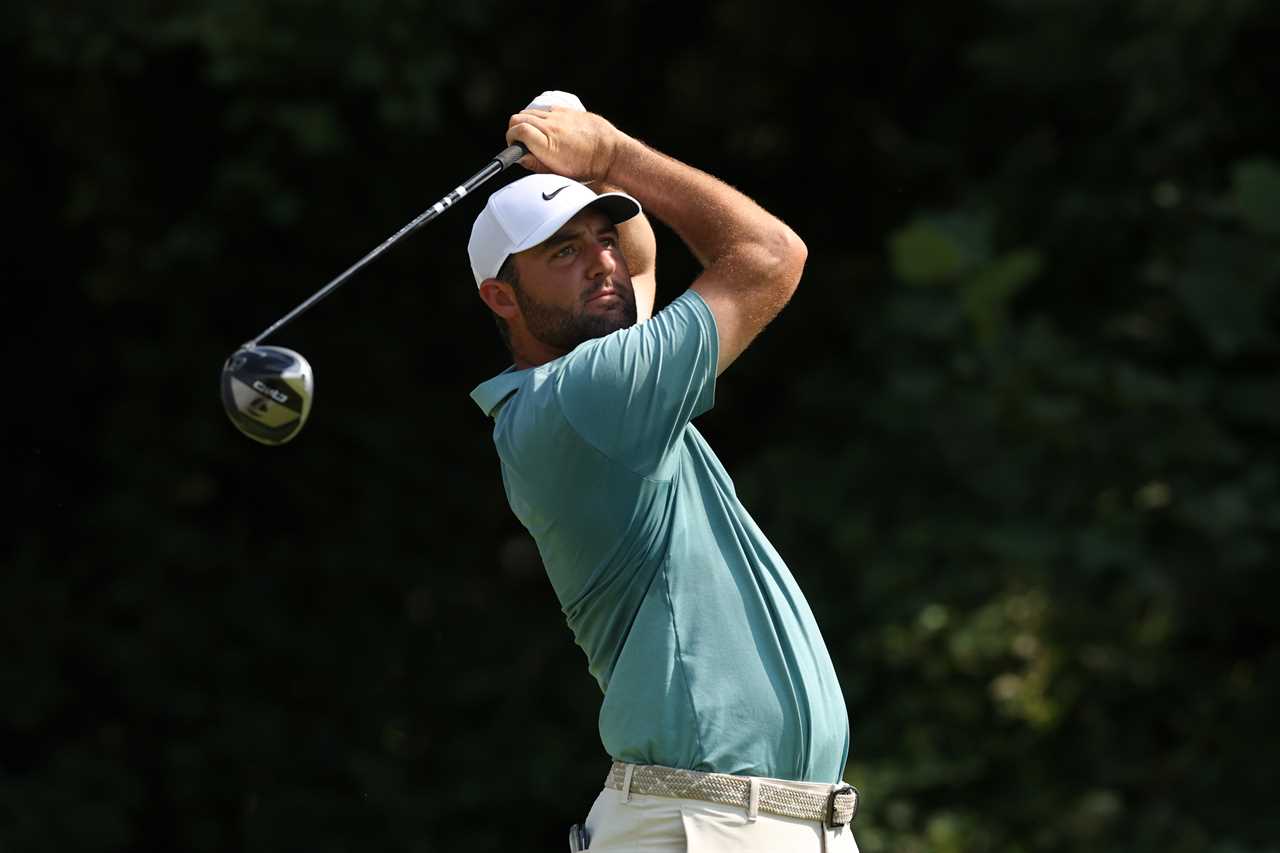 Scottie Scheffler taking a shot during a golf tournament.