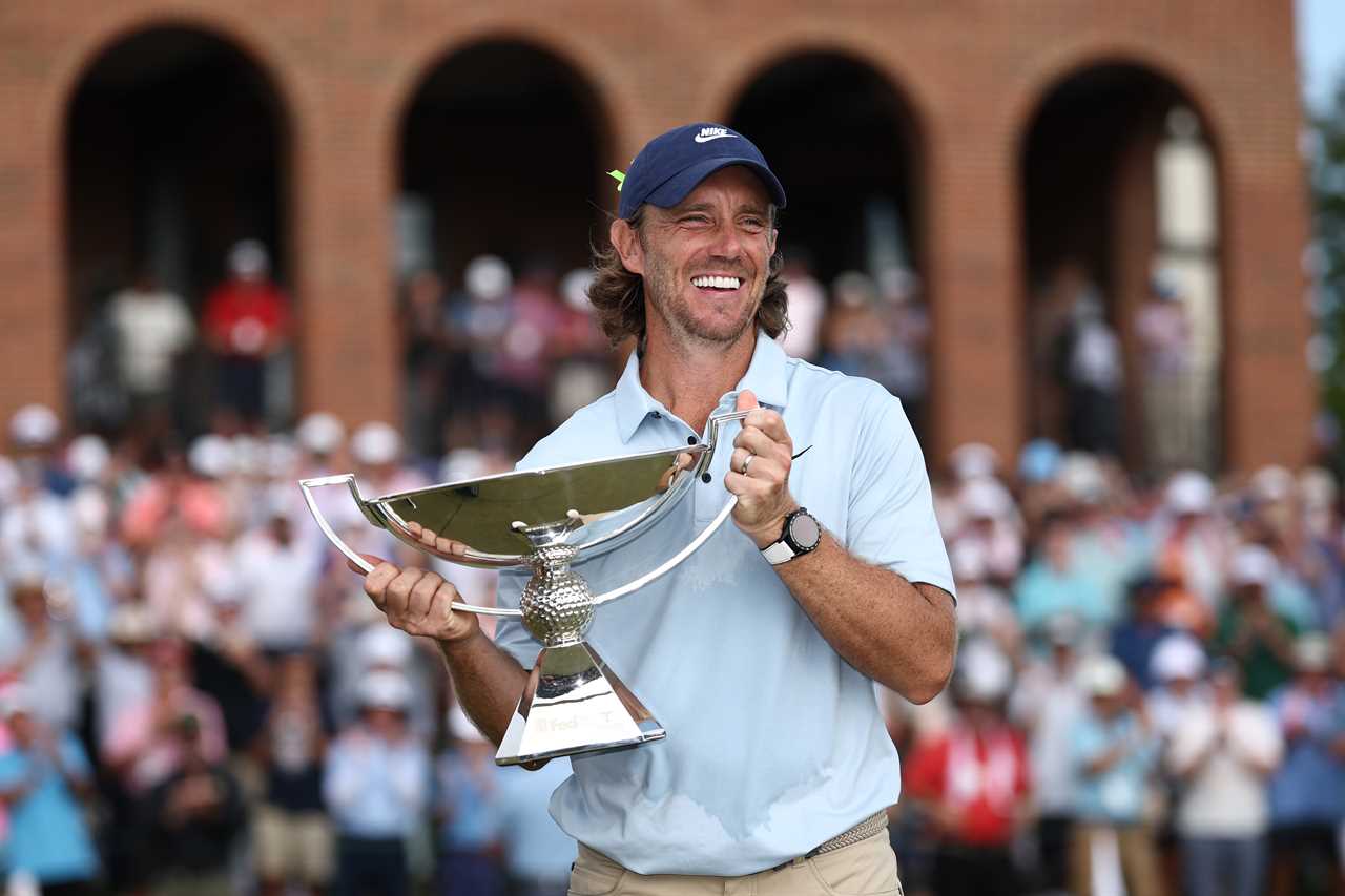 Tommy Fleetwood of England holding the FedEx Cup trophy.